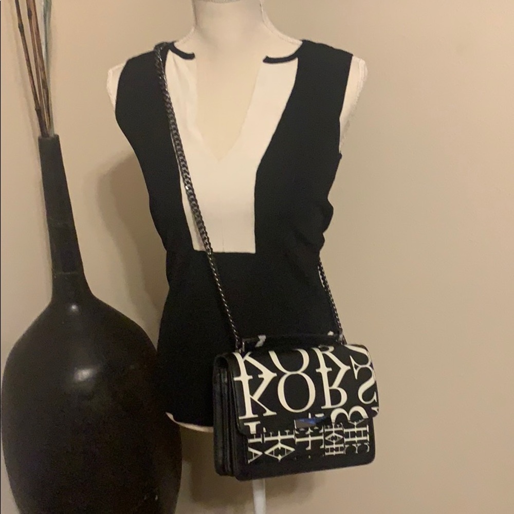 Black and white sleeveless sweater
